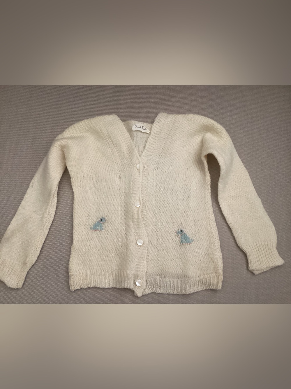 Vtg.1940s pale yellow infant cardigan “HAND MADE” tag with blue dog detail